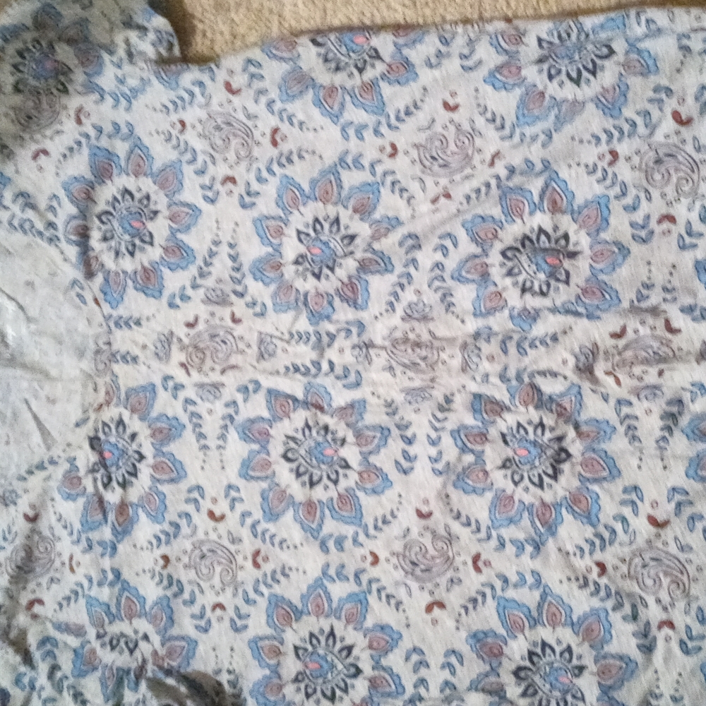 grey t-shirt with designs on it